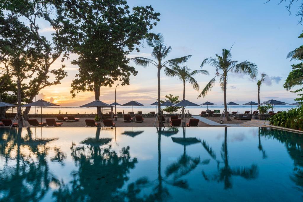 The pool at Andaz Bali as the light goes